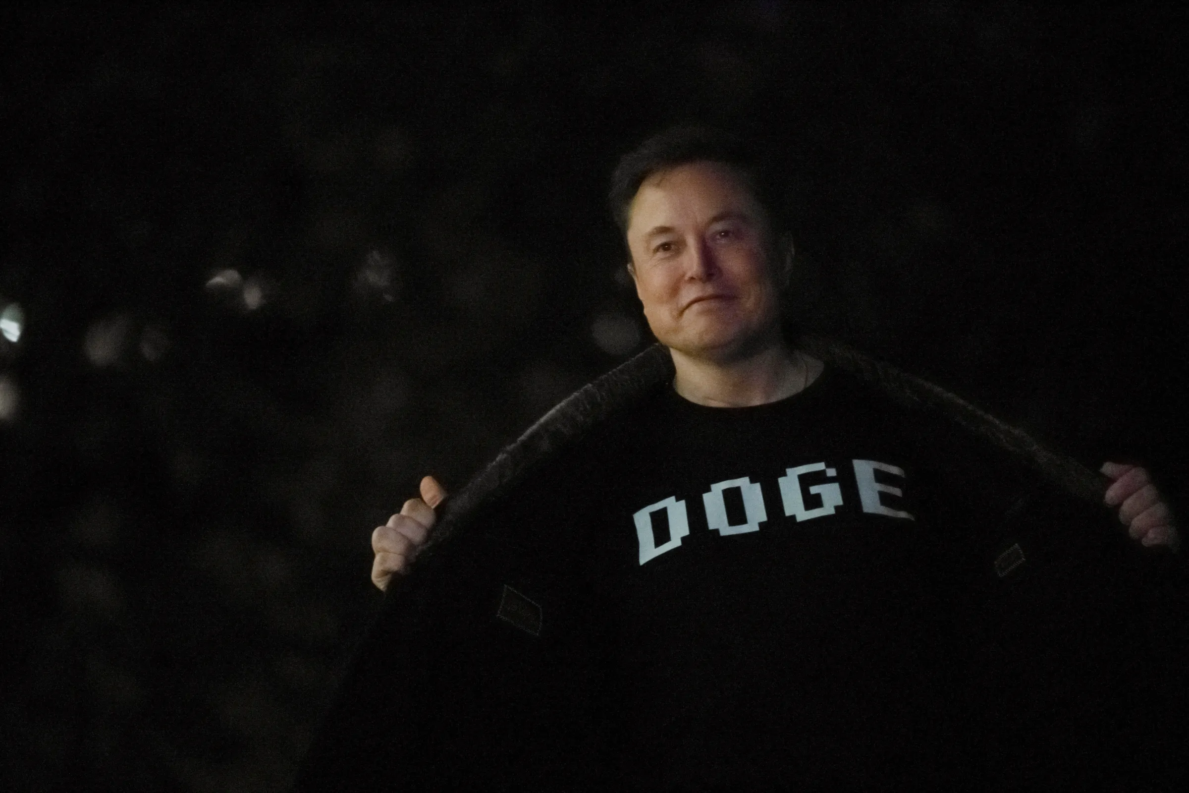 Senior Advisor to the President of the United States Elon Musk shows his shirt to the press as he arrives with U.S. President Donald Trump on the South Lawn of the White House in Washington, D.C., U.S., March 9, 2025. REUTERS/Annabelle Gordon